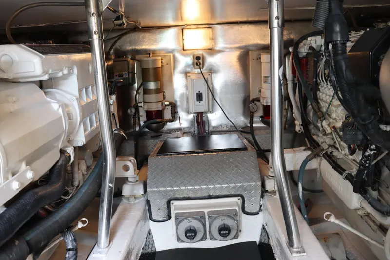 Slide: The Image of Engine room of 2004 Ocean Yachts 43 Super Sport, showcasing mechanical components and wiring. - 9