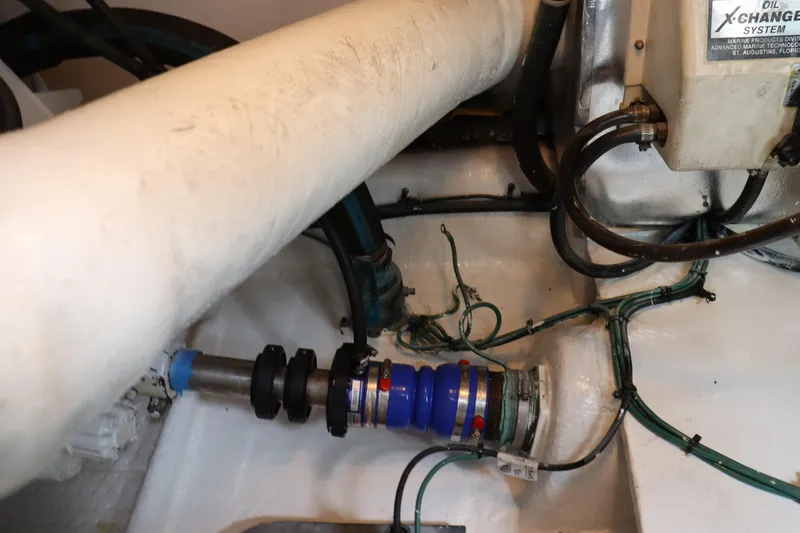 Slide: The Image of Engine room of 2004 Ocean Yachts 43 Super Sport, showcasing mechanical components and wiring. - 10