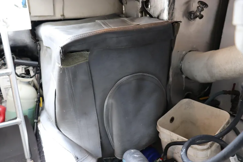 Slide: The Image of Engine room of 2004 Ocean Yachts 43 Super Sport with equipment and storage items. - 11