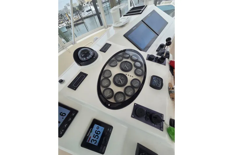 Slide: The Image of Helm of 2004 Ocean Yachts 43 Super Sport with navigation instruments and controls. - 17