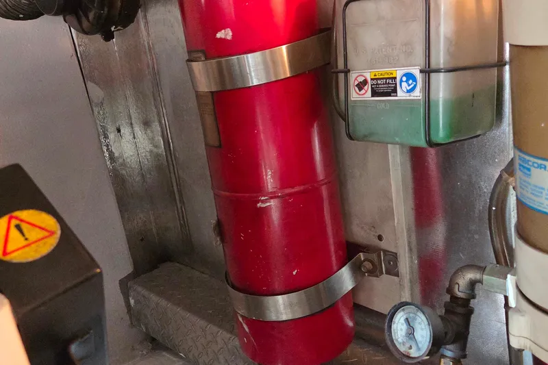 Slide: The Image of Engine room of 2004 Ocean Yachts 43 Super Sport with fire extinguisher and gauge. - 21