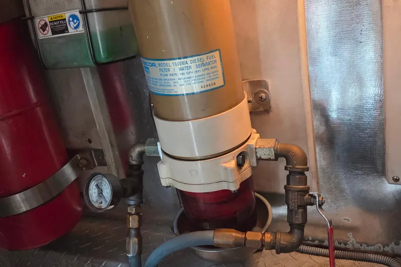 Slide: The Image of Diesel fuel filter system in a 2004 Ocean Yachts 43 Super Sport engine room. - 22