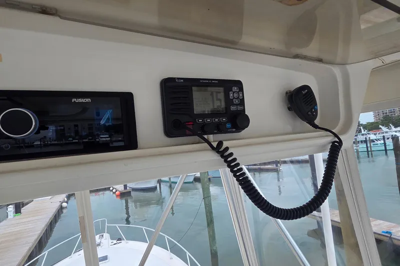 Slide: The Image of Control panel of a 2004 Ocean Yachts 43 Super Sport, featuring marine electronics. - 24