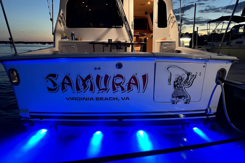Slide: The Image of 2004 Ocean Yachts 43 Super Sport boat with "Samurai" design, docked at sunset, Virginia Beach. - 28