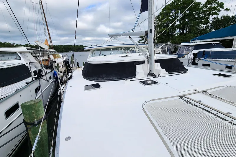 Slide: The Image of 2019 Antares 44GT yacht docked, showcasing sleek design and spacious deck. - 1