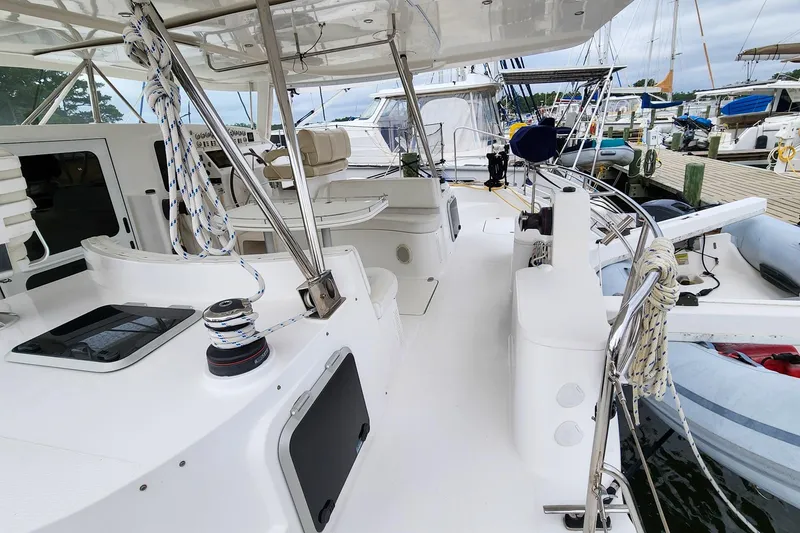 Slide: The Image of 2019 Antares 44GT yacht deck with ropes and seating in a marina. - 12