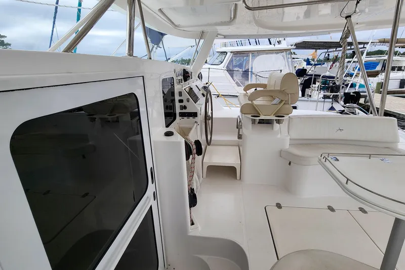 Slide: The Image of 2019 Antares 44GT yacht cockpit with steering wheel and seating area. - 14