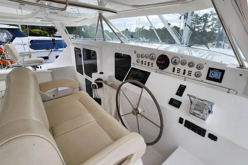 Slide: The Image of Helm of 2019 Antares 44GT yacht with steering wheel and control panel. - 15