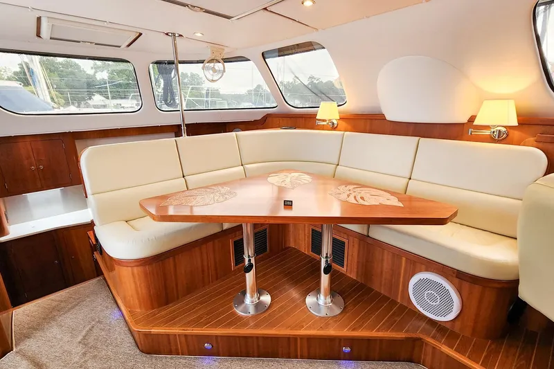 Slide: The Image of Luxurious interior of 2019 Antares 44GT yacht with elegant seating and wooden table. - 27