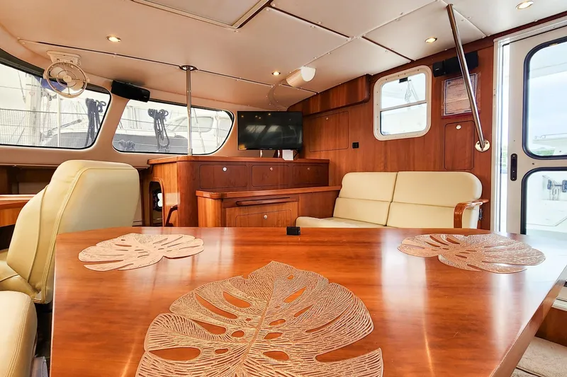 Slide: The Image of Luxurious 2019 Antares 44GT yacht interior with elegant wood finish and comfortable seating. - 29