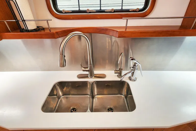 Slide: The Image of Modern kitchen sink on 2019 Antares 44GT yacht with stainless steel fixtures. - 32