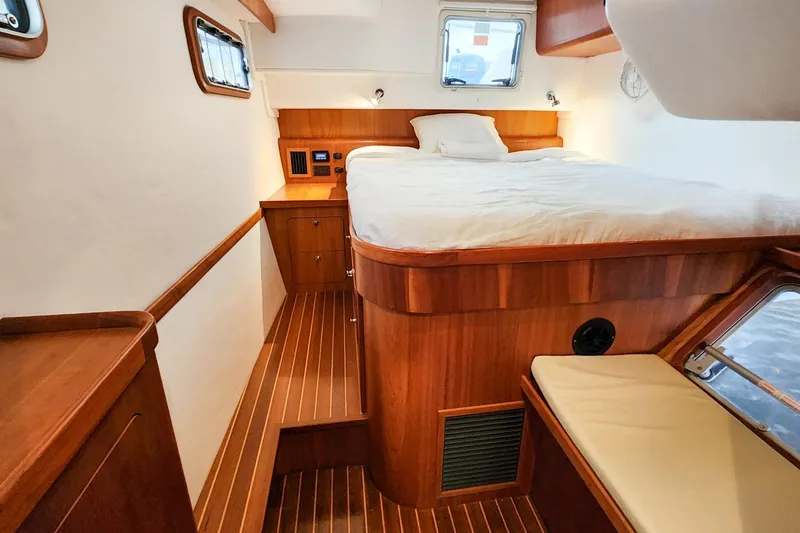 Slide: The Image of Luxurious cabin interior of 2019 Antares 44GT yacht with wooden finish and cozy bed. - 42