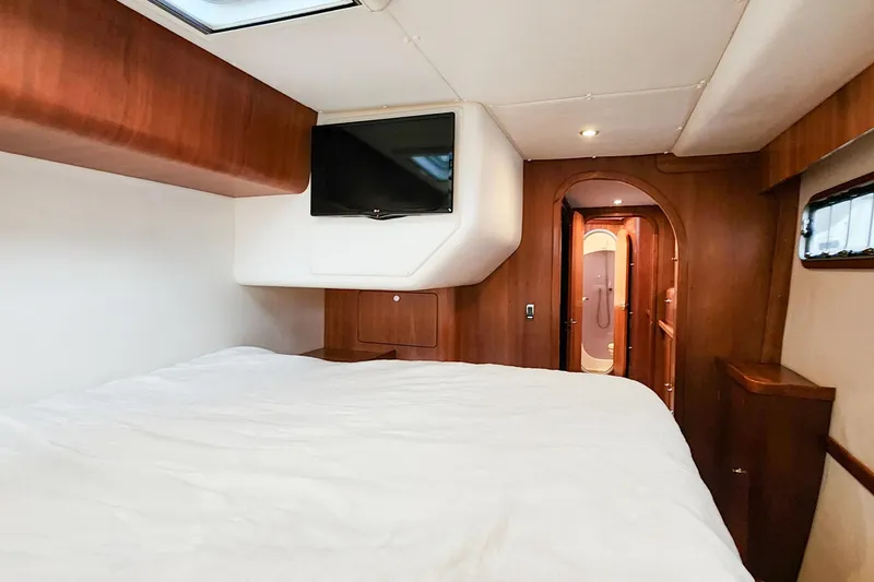 Slide: The Image of Luxurious cabin interior of 2019 Antares 44GT yacht with wood finish and TV. - 43
