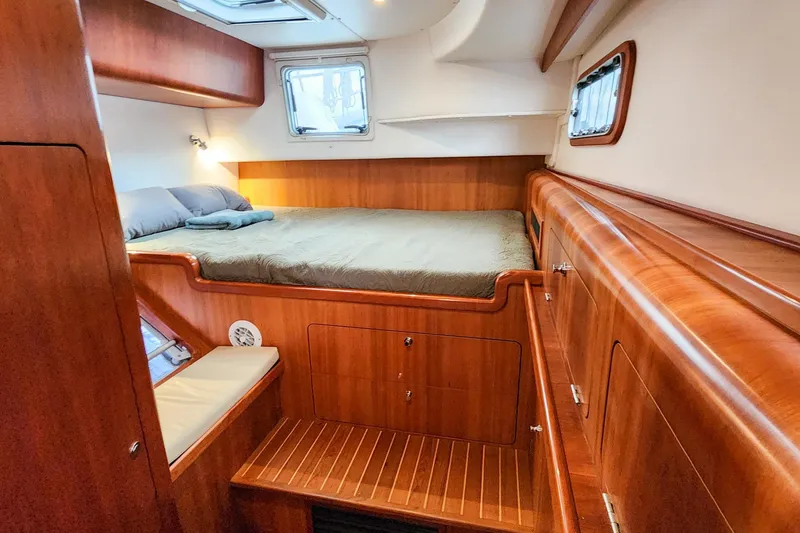 Slide: The Image of Luxurious 2019 Antares 44GT yacht cabin with wooden interior and cozy bed. - 47