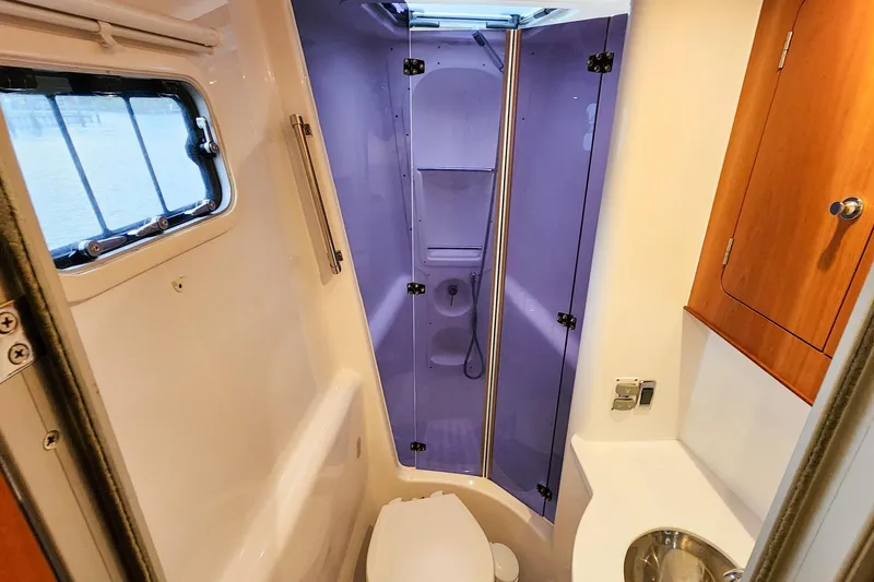 Slide: The Image of Modern bathroom in 2019 Antares 44GT yacht with shower, sink, and window. - 51