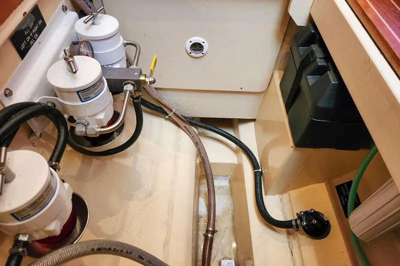 Slide: The Image of Engine compartment of 2019 Antares 44GT with fuel filters and battery box. - 53