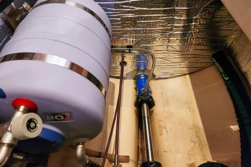 Slide: The Image of Engine compartment of 2019 Antares 44GT with insulated pipes and water tank. - 57