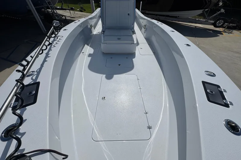 Slide: The Image of 2025 Conch 33 boat deck with seating and storage compartments. - 24