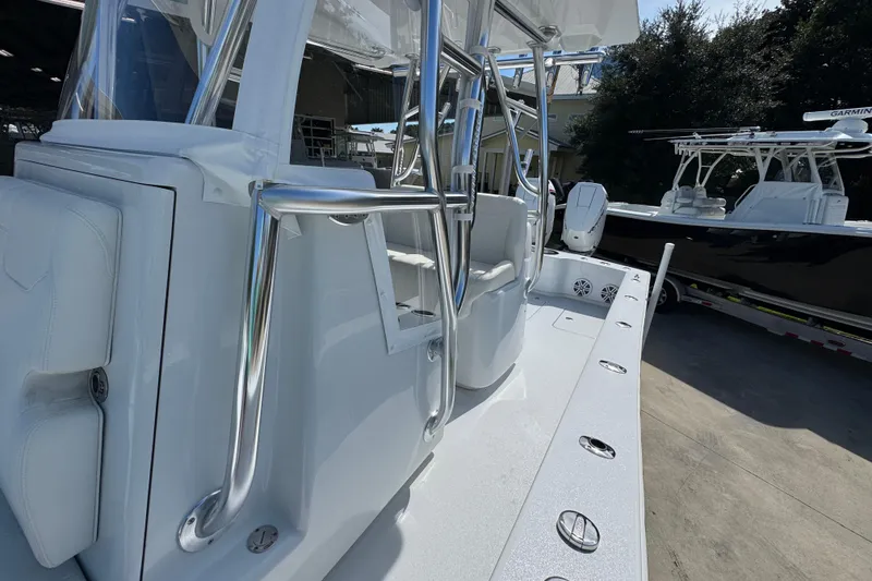 Slide: The Image of 2025 Conch 33 boat with sleek design and modern features, docked outdoors. - 29