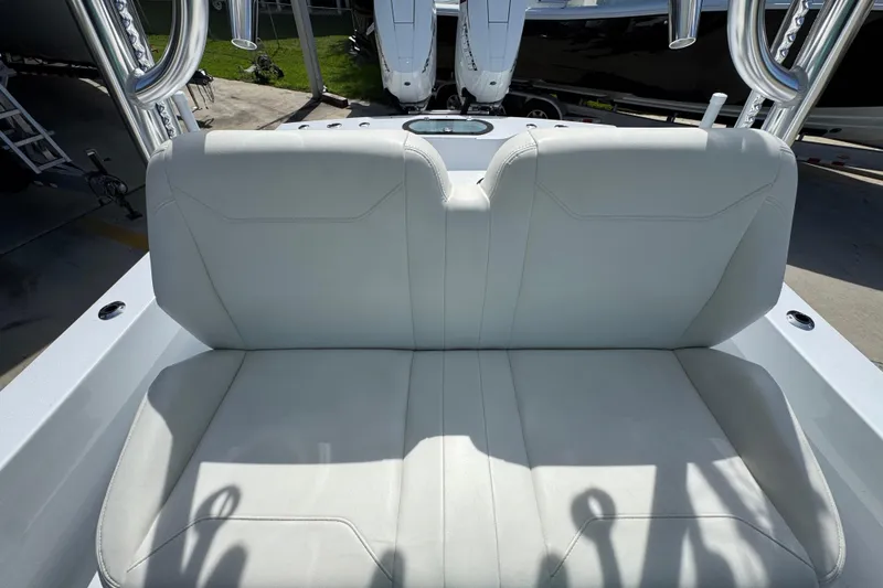 Slide: The Image of 2025 Conch 33 boat with white cushioned seating, showcasing sleek design and comfort. - 32