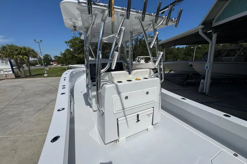 Slide: The Image of 2025 Conch 33 boat with sleek design, docked outdoors under clear blue sky. - 39