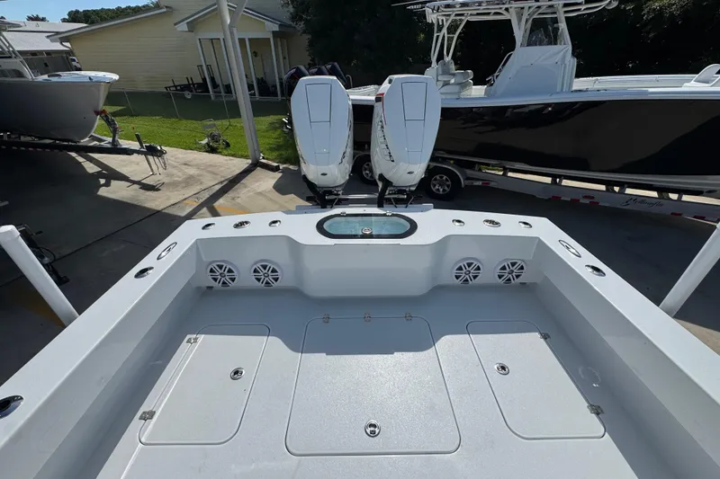 Slide: The Image of 2025 Conch 33 boat with dual engines, spacious deck, and modern design. - 42