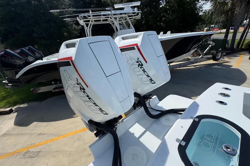 Slide: The Image of 2025 Conch 33 boat with twin 400R outboard engines, parked on a trailer. - 45