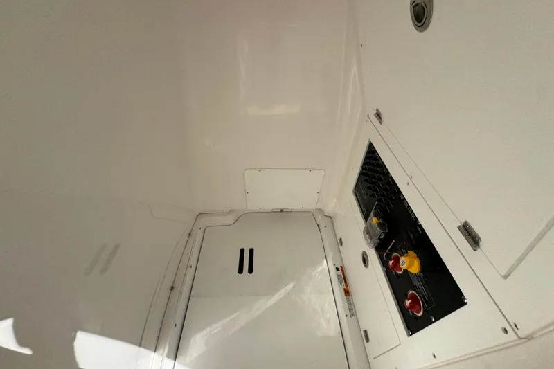 Slide: The Image of Interior view of 2026 Caymas 24 HB boat compartment with control panel. - 26