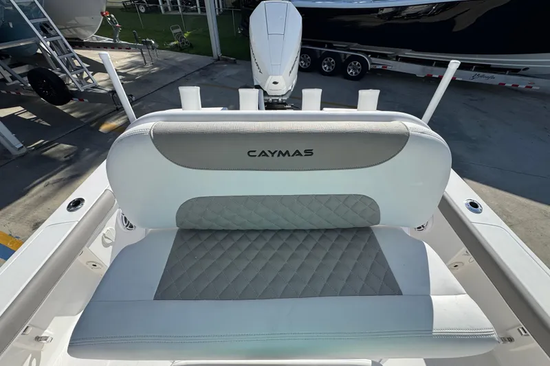 Slide: The Image of 2026 Caymas 24 HB boat seat with diamond-stitched upholstery and logo. - 28