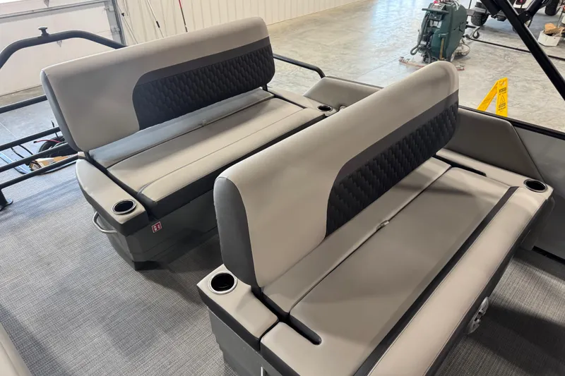 Slide: The Image of 2026 Sylvan L-5 boat interior with gray cushioned seating and cup holders. - 11