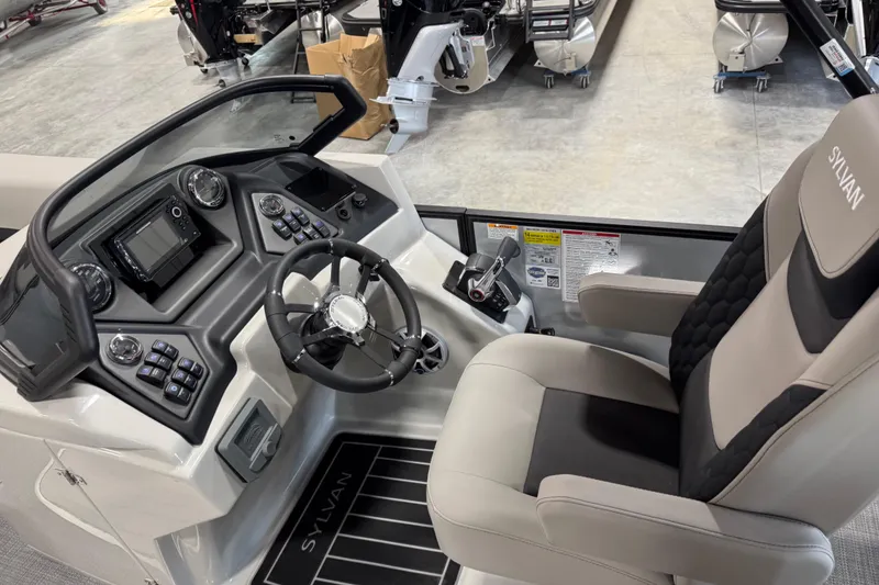Slide: The Image of 2026 Sylvan L-5 boat cockpit with modern steering and control panel. - 9