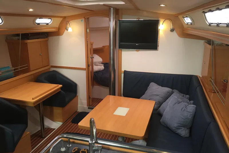 Slide: The Image of Interior of 2007 Hanse 400 yacht with cozy seating and modern amenities. - 11
