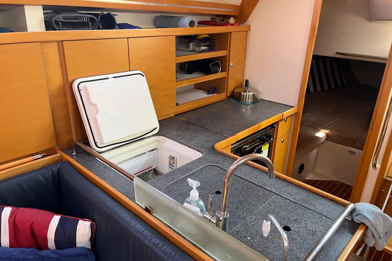 Slide: The Image of Interior of 2007 Hanse 400 yacht kitchen with open fridge and sink. - 14