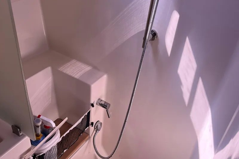 Slide: The Image of Shower area in 2007 Hanse 400 yacht with modern fixtures and storage. - 16