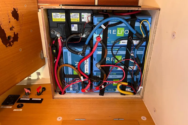 Slide: The Image of Battery compartment of a 2007 Hanse 400 yacht with lithium-ion batteries and wiring. - 22
