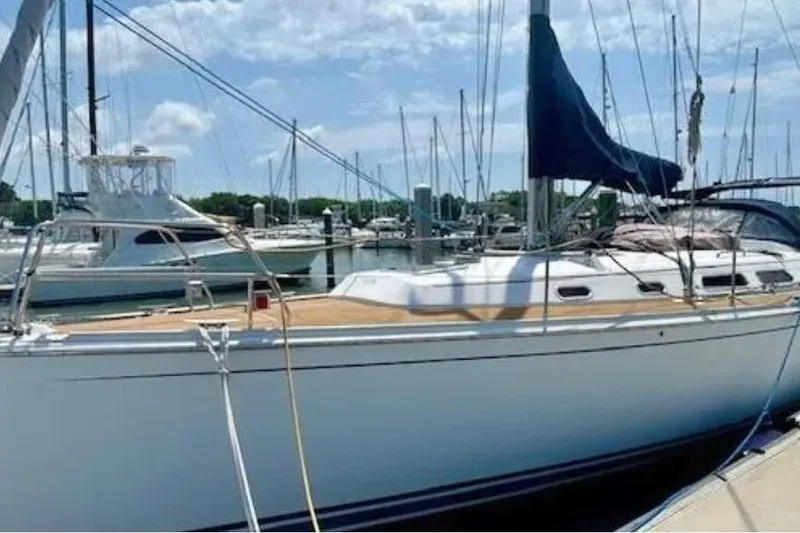 Slide: The Image of 2007 Hanse 400 sailboat docked at marina under blue sky. - 3