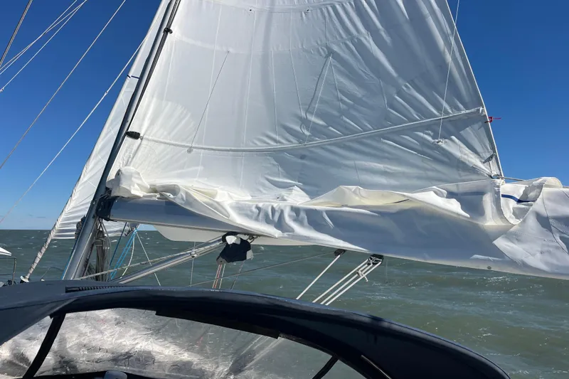 Slide: The Image of Sailing on a 2007 Hanse 400 yacht with white sails against a clear blue sky. - 30