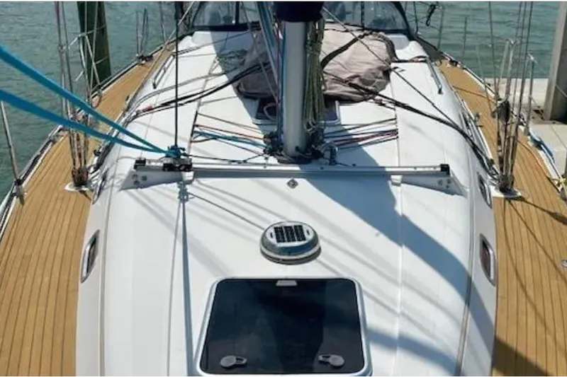 Slide: The Image of 2007 Hanse 400 sailboat deck with wooden finish and rigging details. - 5