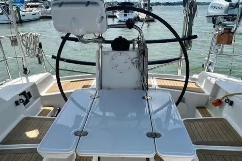 Slide: The Image of Cockpit of 2007 Hanse 400 sailboat with steering wheel and teak flooring. - 8
