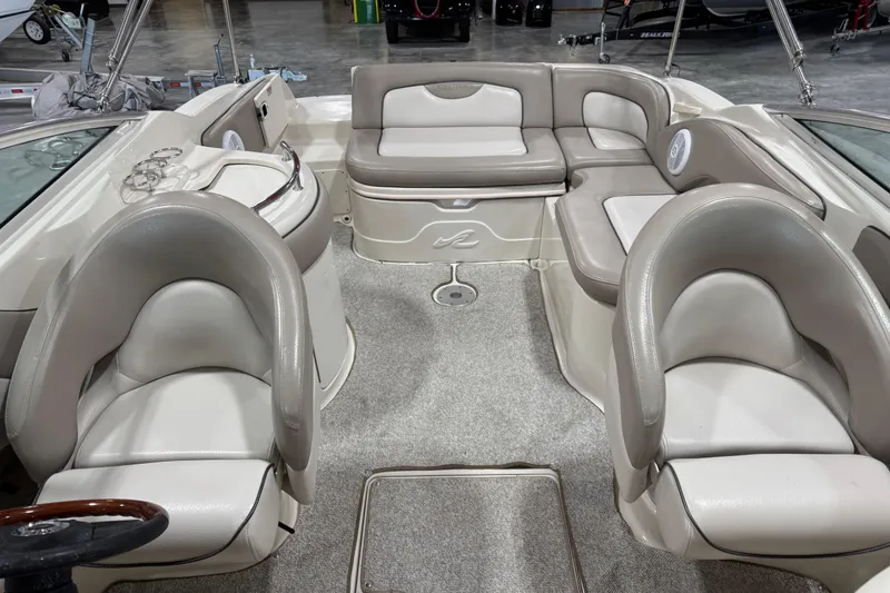 Slide: The Image of 2004 Sea Ray 270 Sundeck interior with plush seating and modern design. - 12
