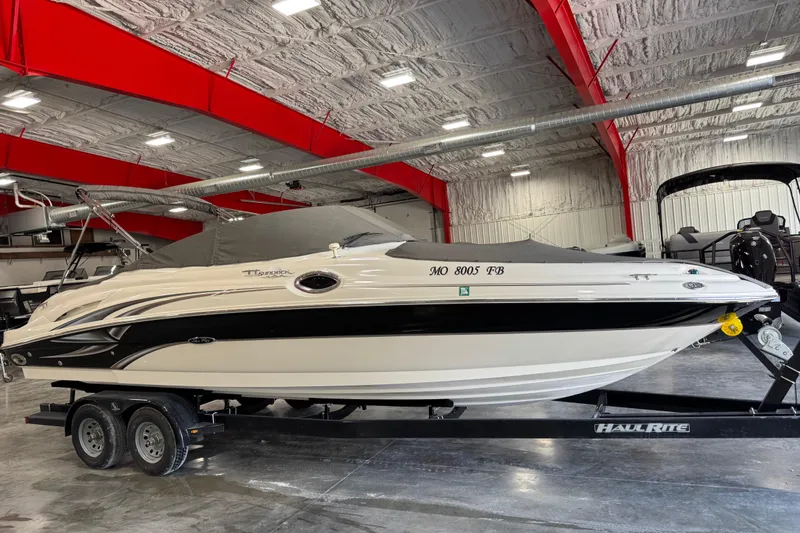 Slide: The Image of 2004 Sea Ray 270 Sundeck boat on trailer in indoor storage facility. - 15