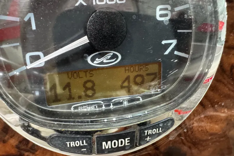 Slide: The Image of Close-up of a Sea Ray 270 Sundeck 2004 boat gauge showing 11.8 volts and 497 hours. - 16