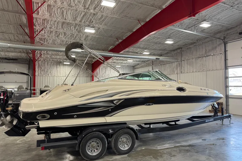 Slide: The Image of 2004 Sea Ray 270 Sundeck boat on trailer in indoor storage facility. - 3
