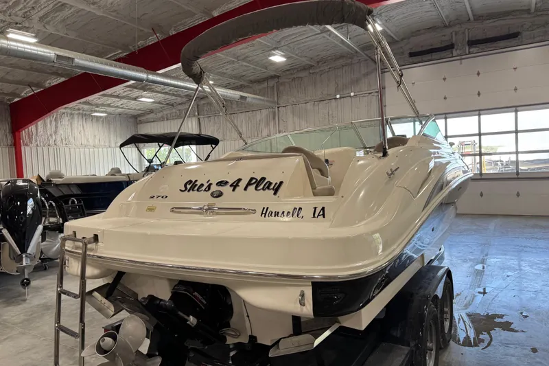 Slide: The Image of 2004 Sea Ray 270 Sundeck boat in indoor storage, rear view. - 5