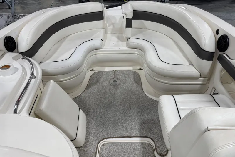 Slide: The Image of Luxurious interior of 2005 Sea Ray 290 SLX boat with plush white seating. - 11