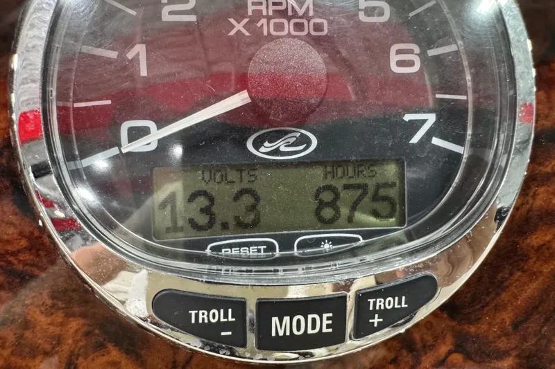 Slide: The Image of Close-up of 2005 Sea Ray 290 SLX tachometer showing 13.3 volts and 875 hours. - 12