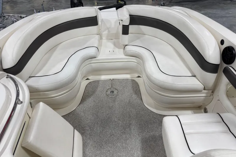 Slide: The Image of 2005 Sea Ray 290 SLX boat interior with white and gray seating arrangement. - 9