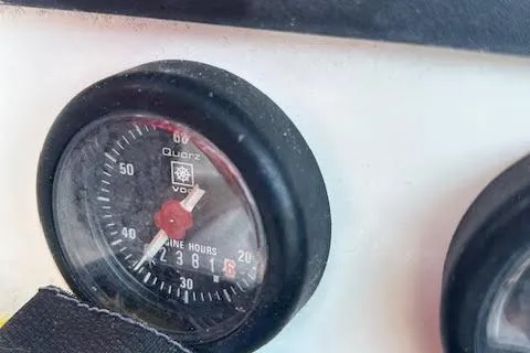 Slide: The Image of Close-up of Jeanneau Deck Salon 43 engine hour meter, showing 2381 hours. - 12