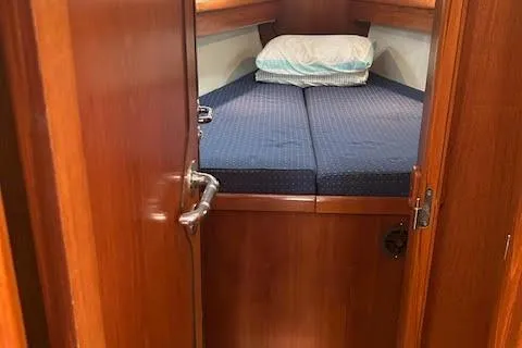 Slide: The Image of 2005 Jeanneau Deck Salon 43 cabin interior with bed and wooden finish. - 22