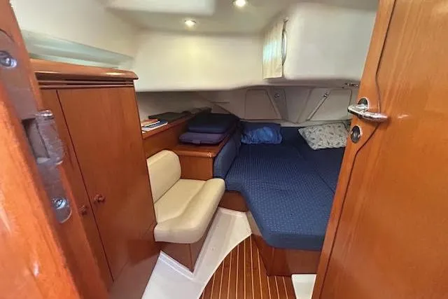 Slide: The Image of Cozy cabin interior of 2005 Jeanneau Deck Salon 43 sailboat with wooden finishes. - 23